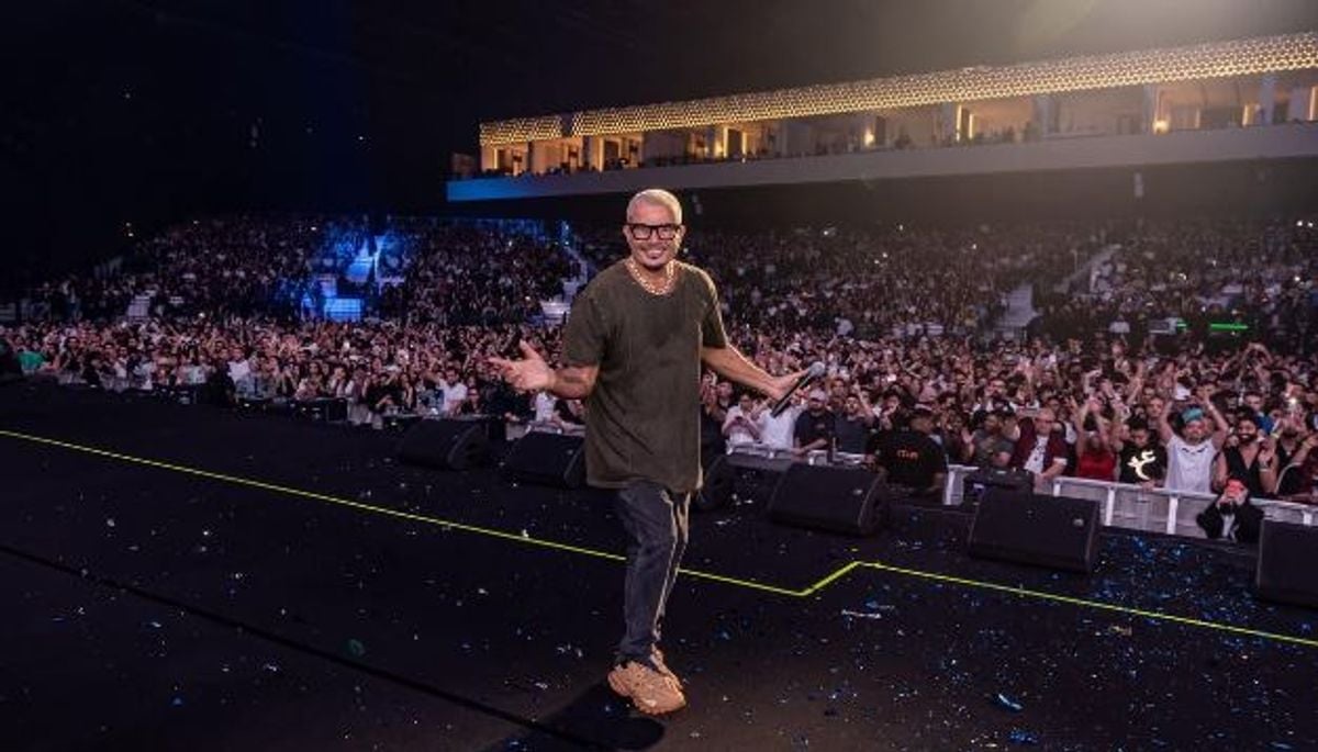 Amr Diab performing on stage at Jeddah concert