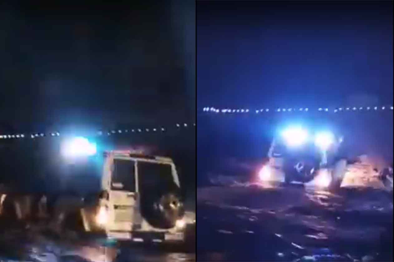شاهد.. رجل أمن يغامر بنفسه لإنقاذ محتجزين وسط سيول أبو عريش